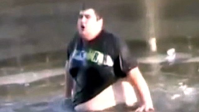 Guy Jumps Into Frozen Lake