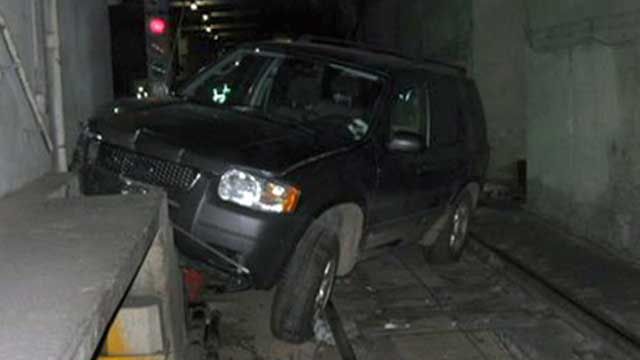 SUV Gets Stuck in Tunnel
