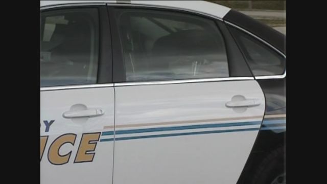 Suspect Crawls Through Cop Car Window