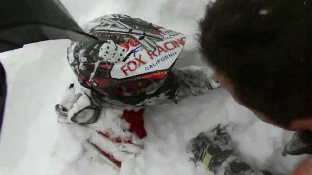Helmet camera captures avalanche, snowmobiler rescue