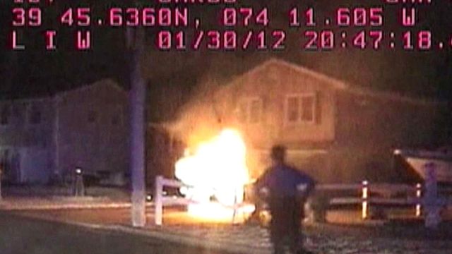 Police rescue man from burning car