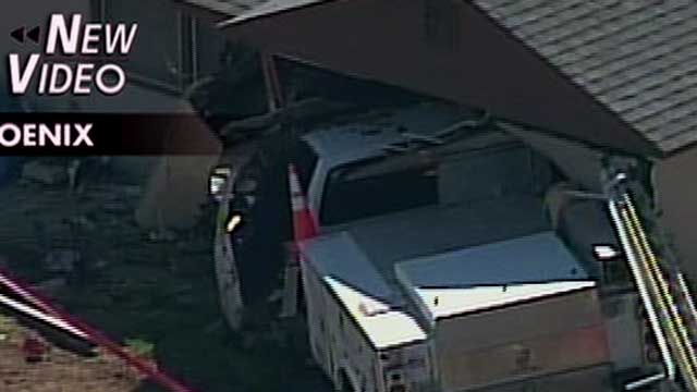 Truck Smashes into House