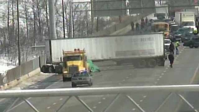 Across America: Tractor Trailer Cab Falls Off Bridge