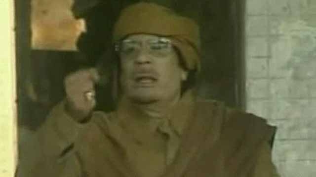 Qaddafi Clings to Power by Casting Blame