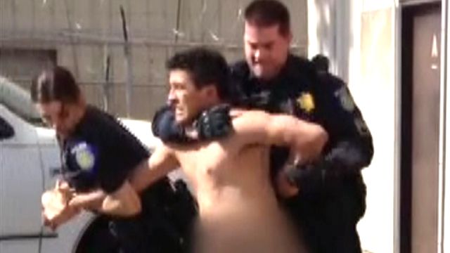 Naked man fights cops