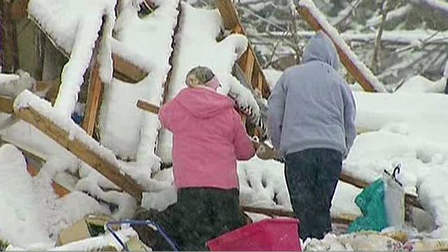 Snow, cold temps hit twister-ravaged areas