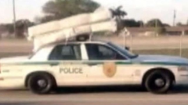 Cop spotted transporting mattress, box spring with car