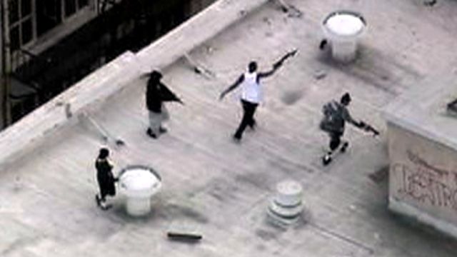 Men Play w/ Fake Guns on LA Rooftop