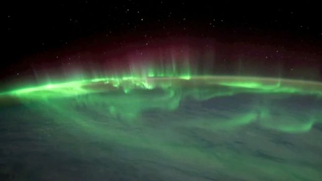 What causes auroras?