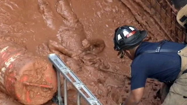 Man buried alive in tons of mud pulled to safety