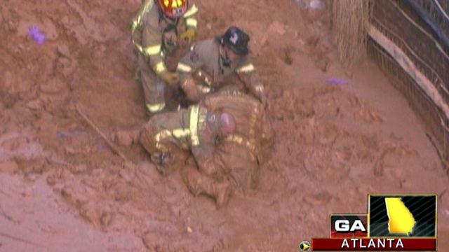 Across America: Rescuers save man buried alive in mud