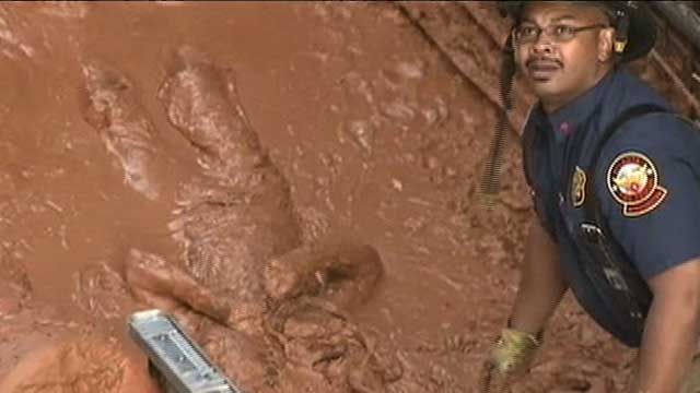 Amazing Video: Man Pulled from Tons of Mud