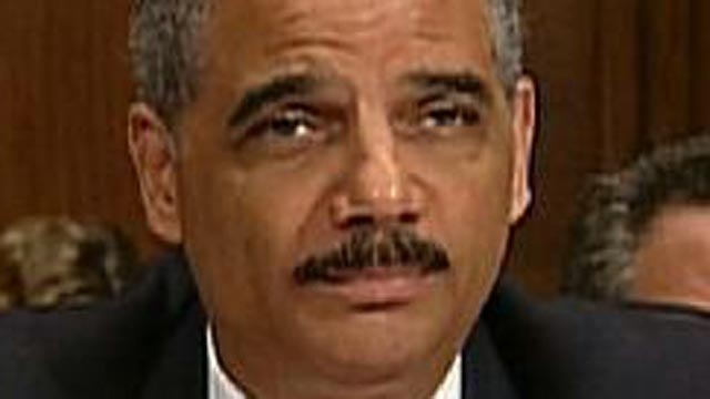 Holder in the Hot Seat