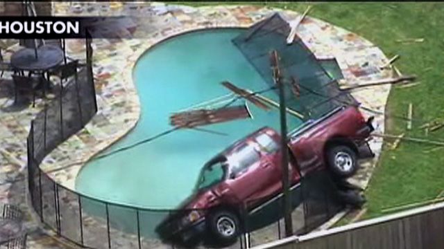 Truck Lands in Swimming Pool