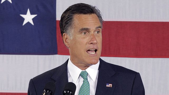 Romney attacks Obama's record near DNC site