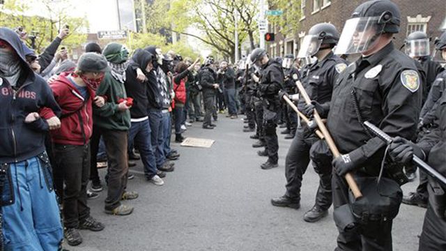 Police clash with protesters during violent May Day riots
