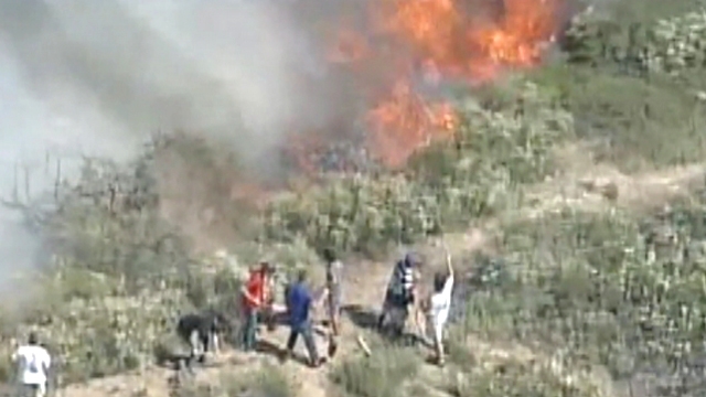 Residents Pitch In to Fight Raging Brush Fire