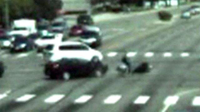 Car runs light, smashes into motorcyclist
