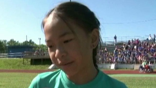 9-year-old races with new prosthetic legs
