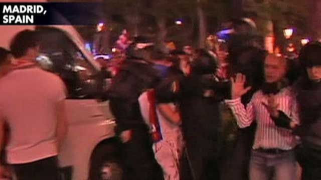 Soccer Fans Clash with Riot Police in Spain
