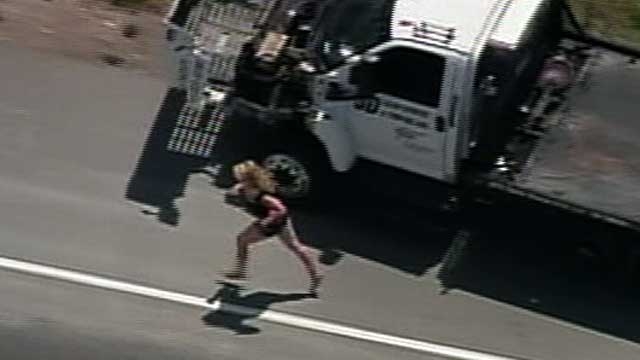 Woman Flees Police in Tow Truck