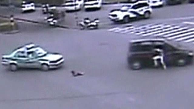 Toddler tumbles out of moving van