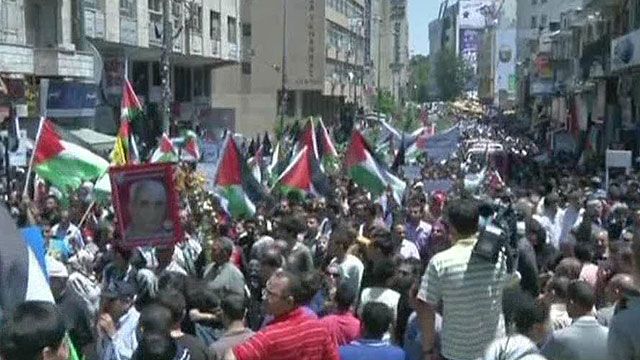 Palestinians march in annual mourning ritual