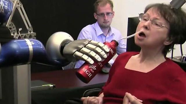 Paralyzed woman controls robot with her mind