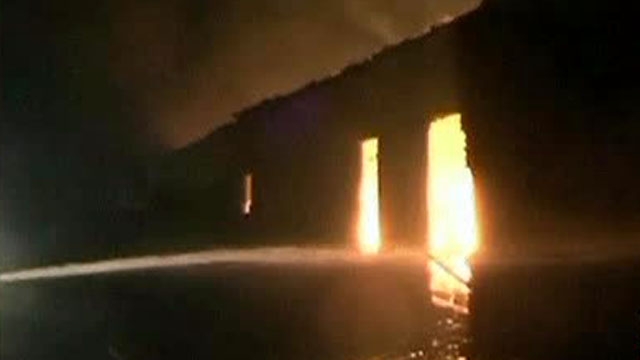 Around the World: Warehouse Goes Up in Flames