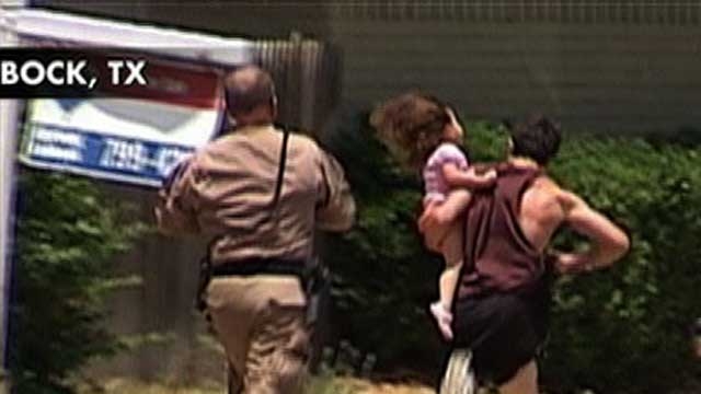 Suspect Runs with Child in His Arms