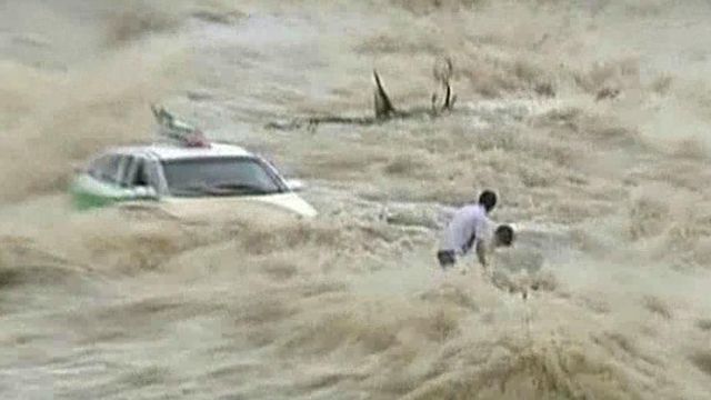 Around the World: Heavy rains cause dam to overflow in China