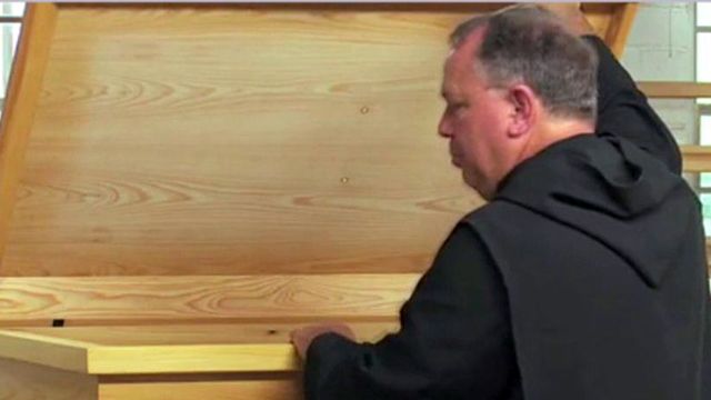 Monks sued over caskets
