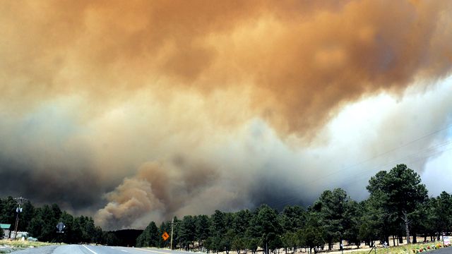 Massive wildfires force evacuations out West