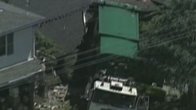 Runaway Dump Truck Hits 2 Homes