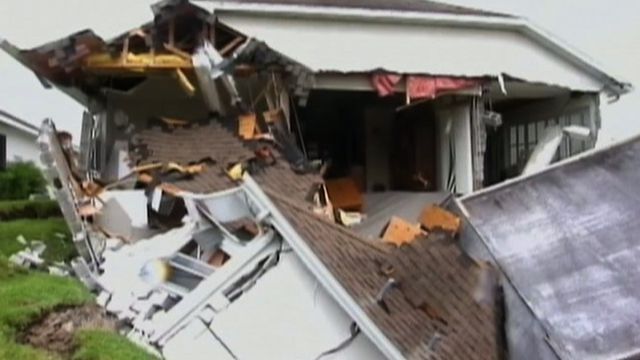 Giant Sinkhole Swallows Half of a House
