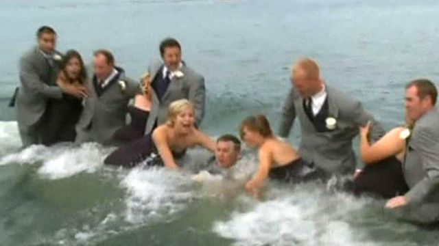 Wedding party takes plunge after dock collapse