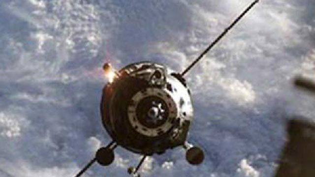 Supply Ship Spins Past Space Station
