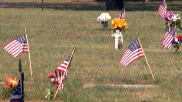 Outcry after town limits flags on veterans' graves
