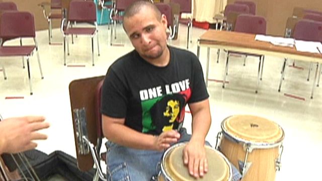 Blind Musician Marches to the Beat of His Own Drum
