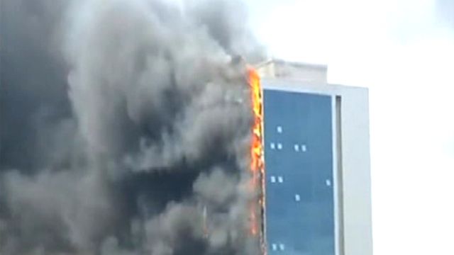 Raging inferno burns through 42-story building