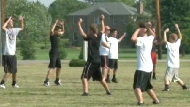 Football Players Practice in Extreme Heat