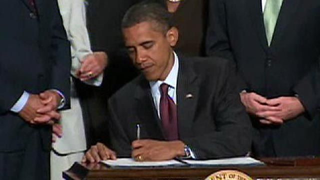 Obama Signs Financial Overhaul Legislation