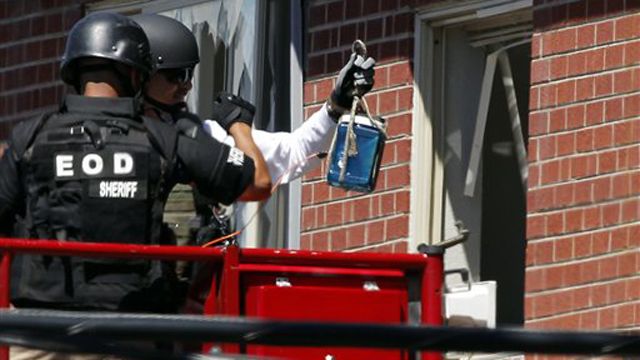 Police working to enter suspect's booby-trapped apartment