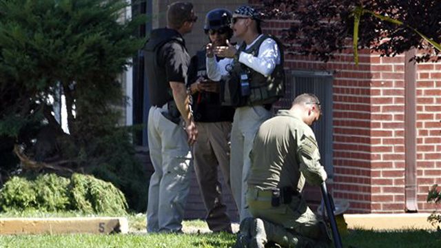 Bomb units disarm explosives inside shooting suspects home