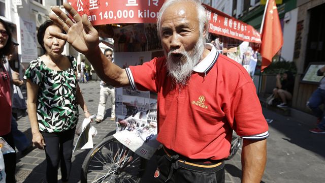 Chinese farmer bikes 30,000 miles to reach London Olympics