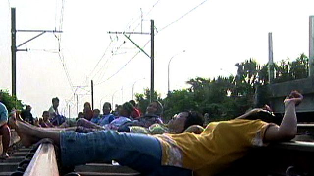 People Lie on Railroad to Cure Health Problems