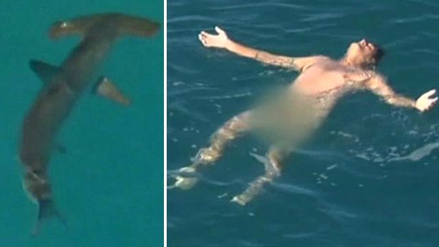 Naked fisherman rescued as sharks close in