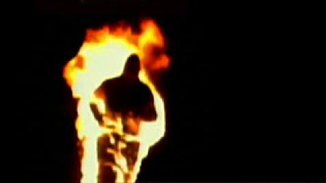 Man Runs Around on Fire on Baseball Field