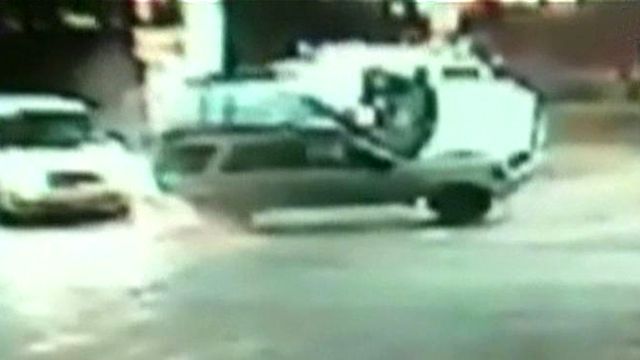 SUV Flips Into Gas Station