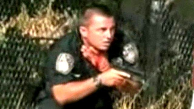 Graphic Video: Officer Shot in Neck During Firefight